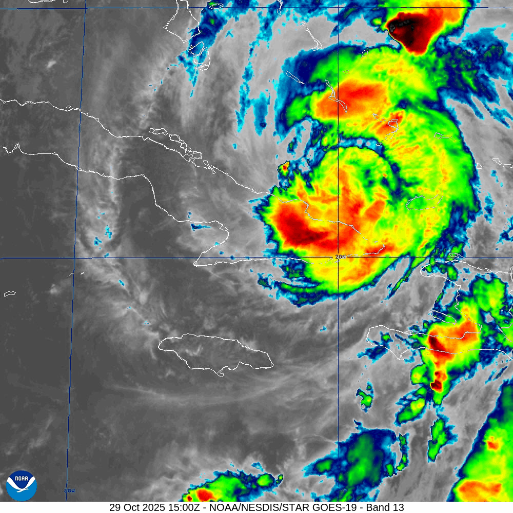 A satellite map of a hurricane in vibrant colors swirling over eastern Cuba. Dense cloud bands and the storm’s defined movements appear against a gray grid background.