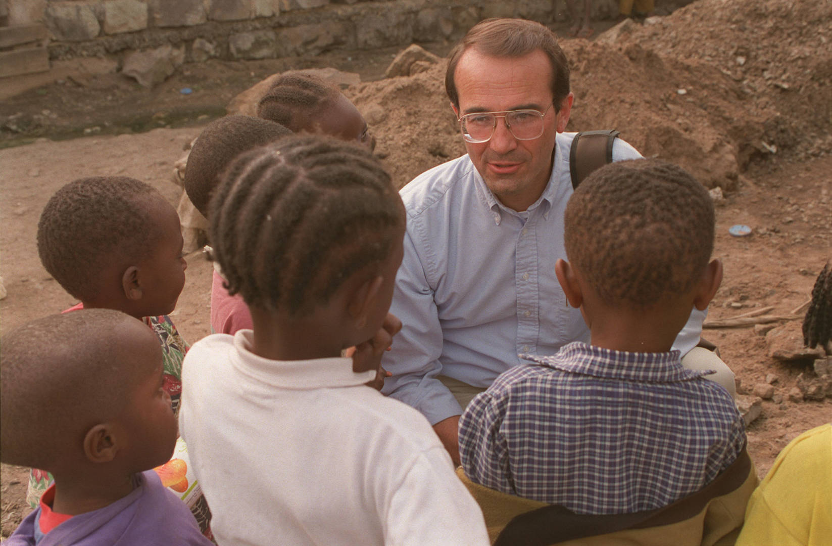 Former World Vision Vice President of Finance Ken Casey meets with children in South Africa.