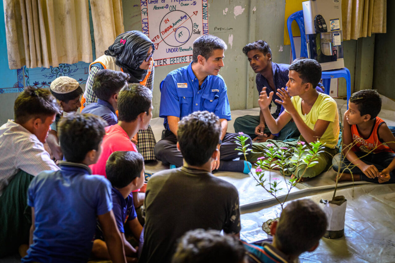 Edgar in Bangladesh World Vision U.S. President and CEO Edgar Sandoval Sr. listens to a teenage boy share his story at a vocational training center in a Rohingya refugee camp in Cox’s Bazar, Bangladesh.Oka