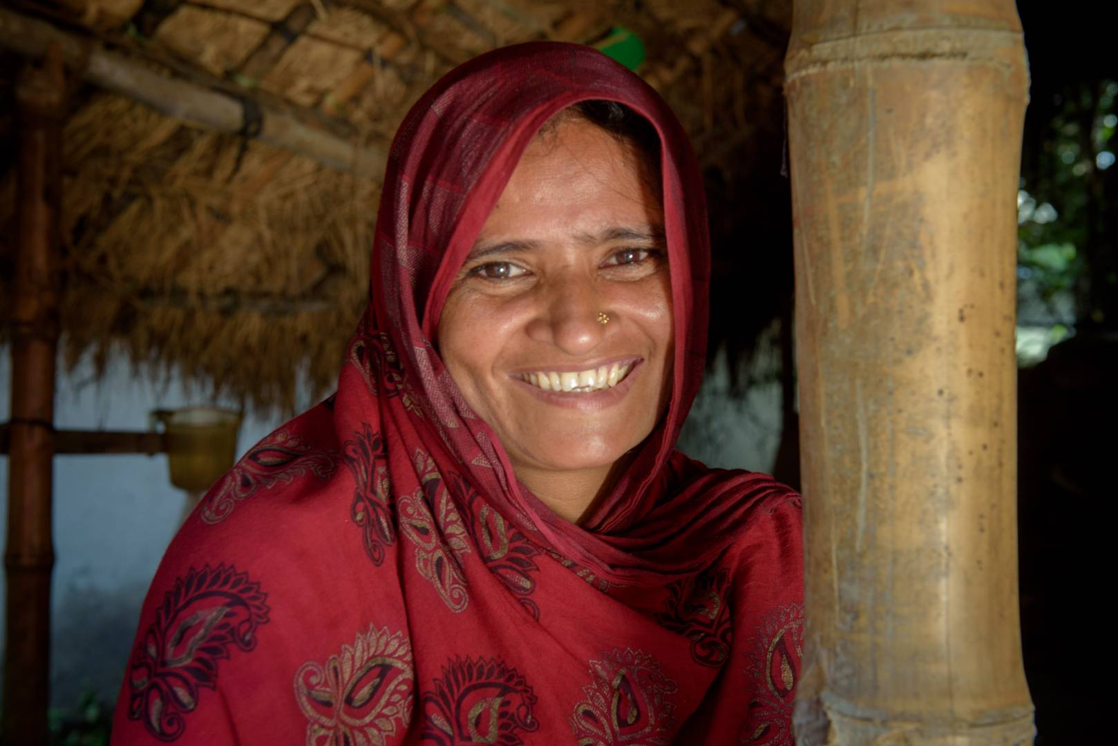 Ravia is all smiles because of the changes in her family since her husband joined a World Vision Men Care group.