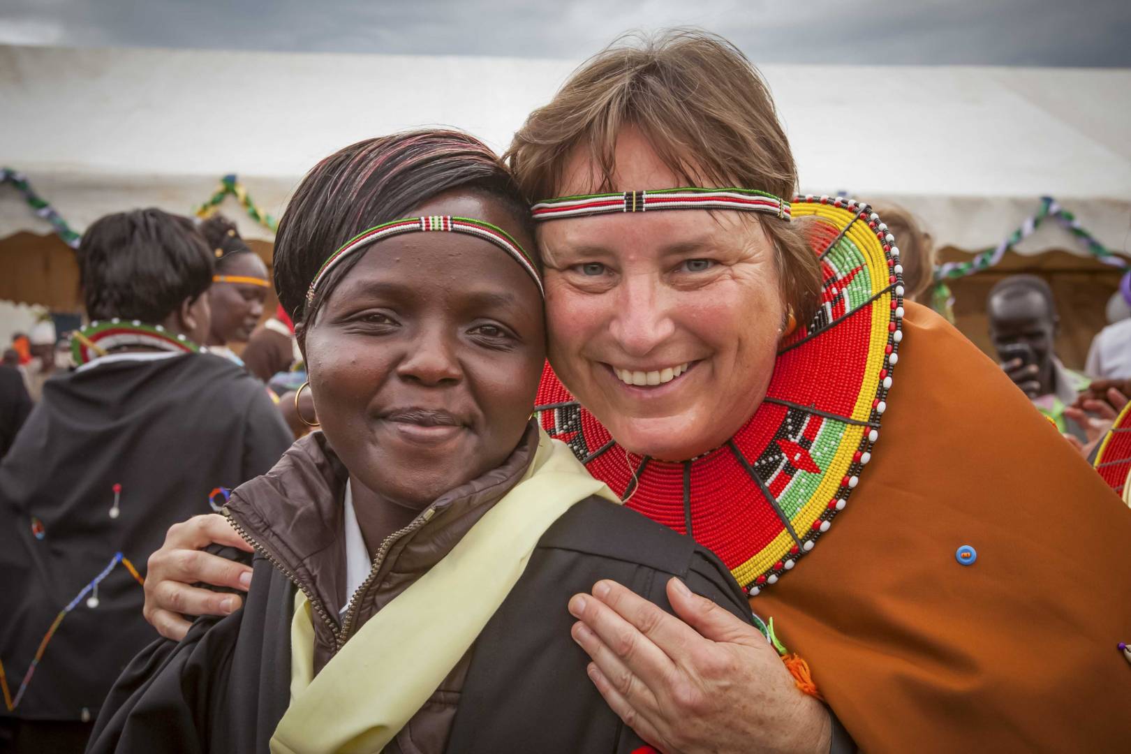 Margo Day in Kenya Margo Day smiles with a friend named Lillian during Margo’s 2014 trip to Kenya to celebrate an expansion of the school she funded. She initially met Lillian during a 2009 visit at the rescue center.