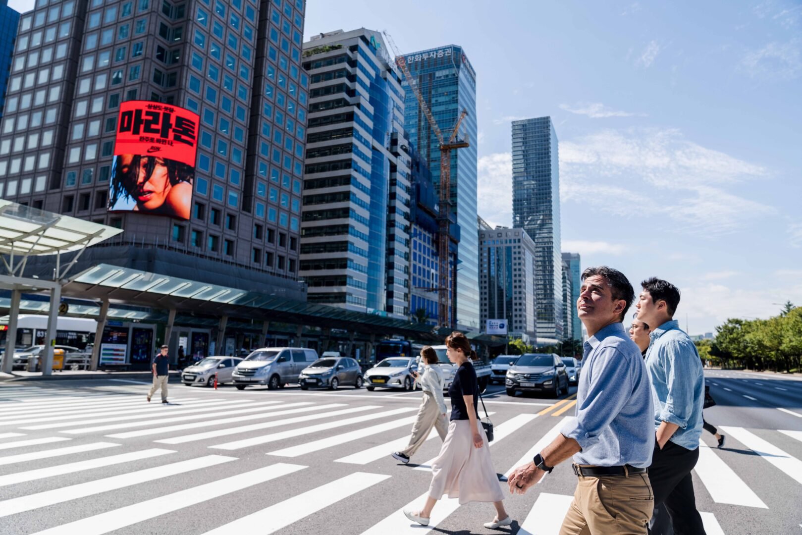 edgar walking across a street
