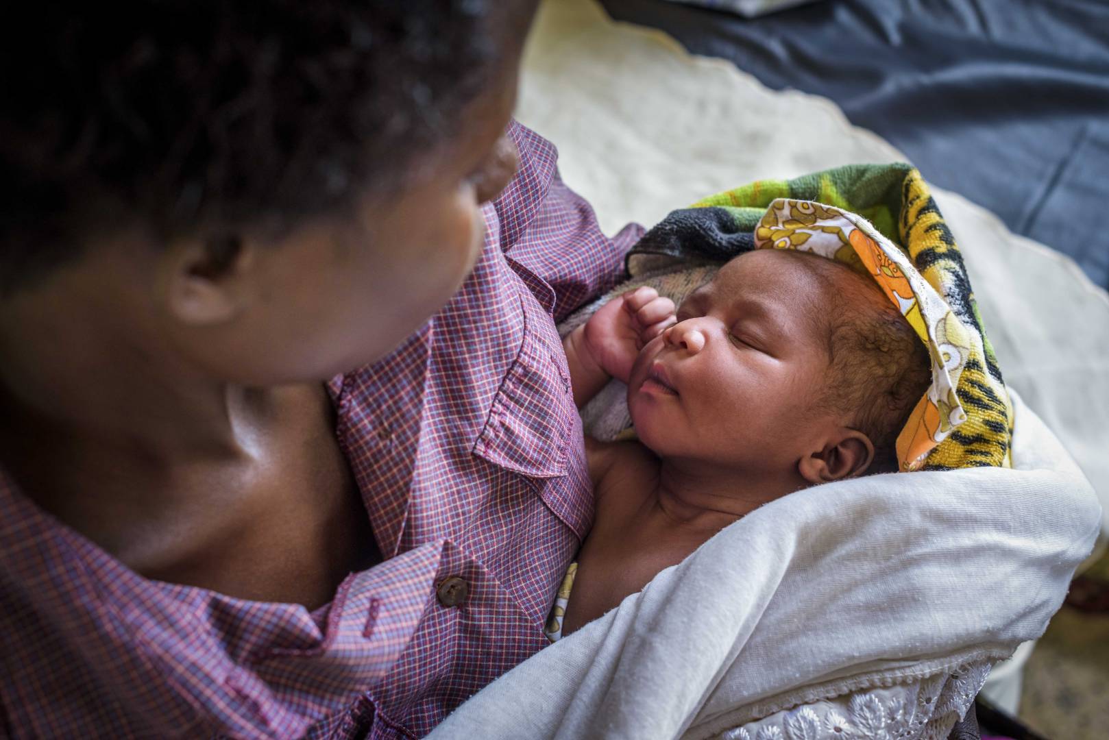 Life Mother Child Health Kenya ELO Lydia Atugonza, 23, holds her newborn daughter, delivered that night in a clinic funded by ELO in Uganda. With her first two children, she had to travel a long way to give birth and then go home right after. The clinic has delivery rooms with clean water as well as a new mothers room for her to stay.