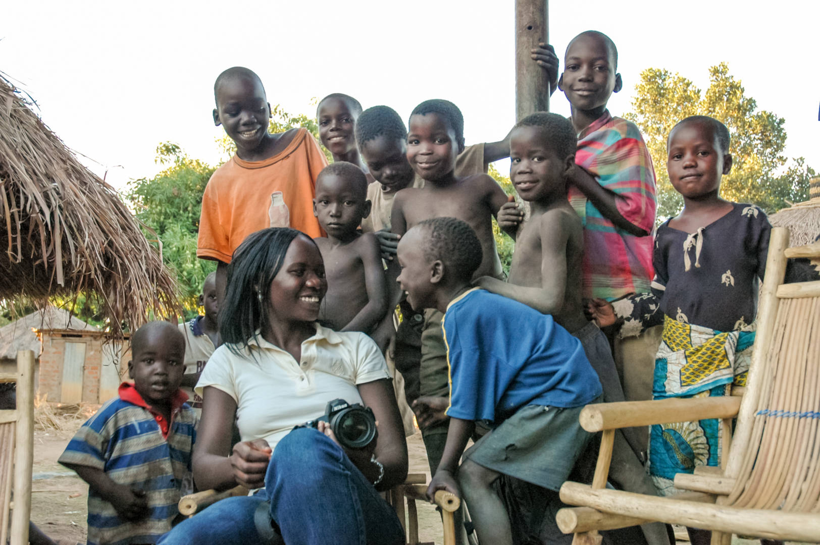 Margaret Alerotek, communications officer for World Vision in Uganda, is surrounded by children in Gulu, Uganda.