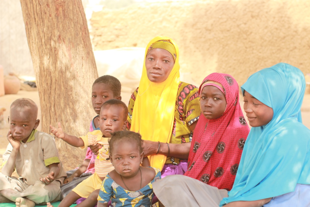 Rabi Saidou_ a farmer and land owner with her children in Niger