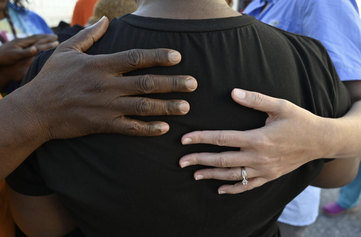 People gather during a World Vision–supported distribution of Hurricane Helene relief supplies in Arden, North Carolina, with staff and volunteers, offering hope and help to impacted families. (© 2024 World Vision/photo by Tom Costanza)